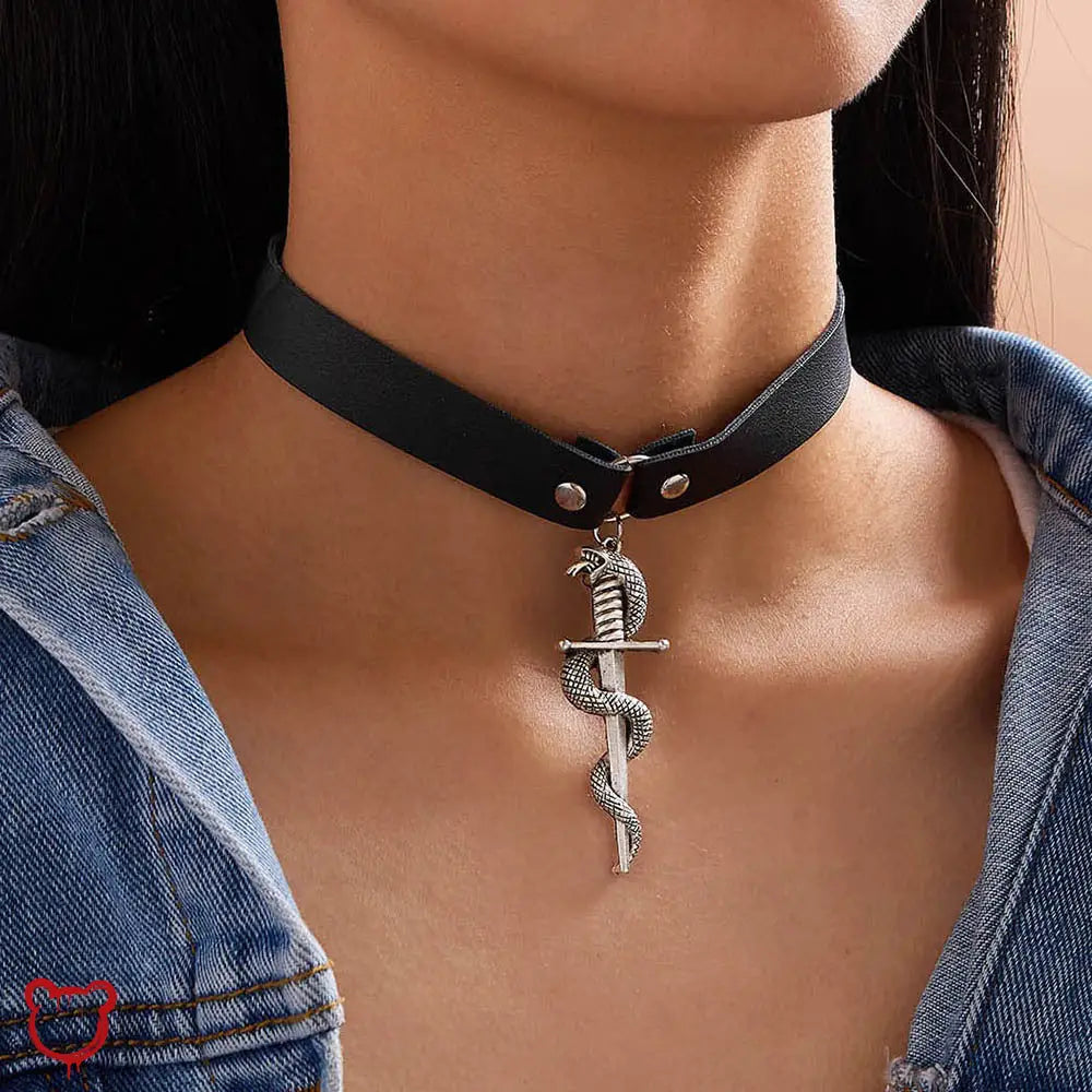 Snake Dagger Pendant Choker - Maximum 5 Words:
1. Serpent Blade Necklace
2. Coiled Choker
3. Viper
