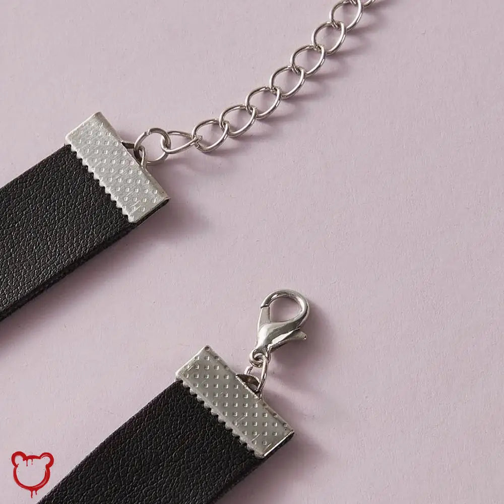 Snake Dagger Pendant Choker - Maximum 5 Words:
1. Serpent Blade Necklace
2. Coiled Choker
3. Viper